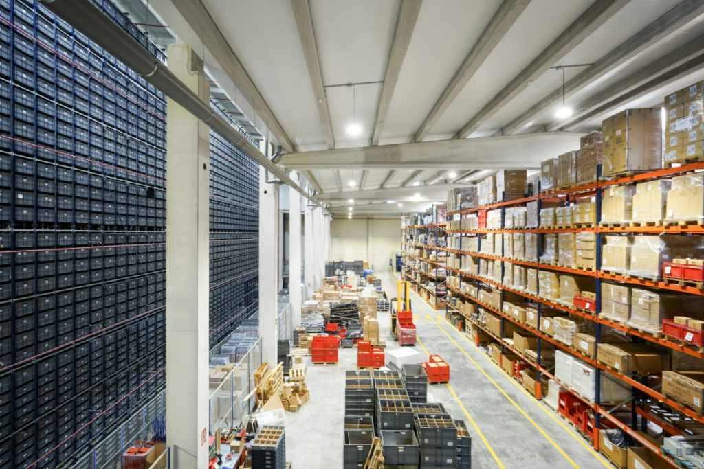 A distribution warehouse with boxes on shelves